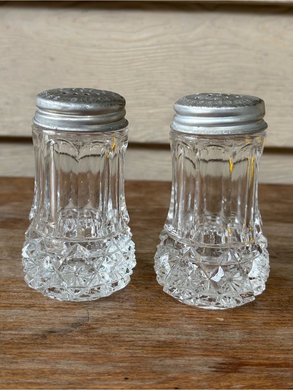 VTG cut crystal sugar shaker featuring a diamond point pattern on the base.